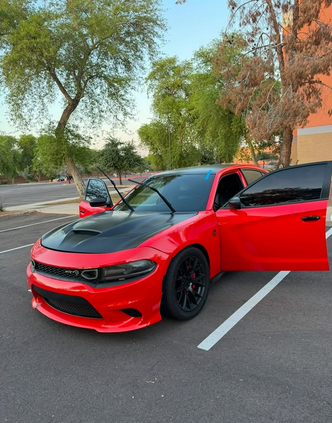 Red Dodge Charger with a freshly serviced windshield